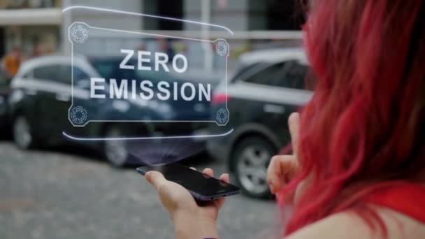 Redhead woman interacts HUD Zero Emission — стоковое видео