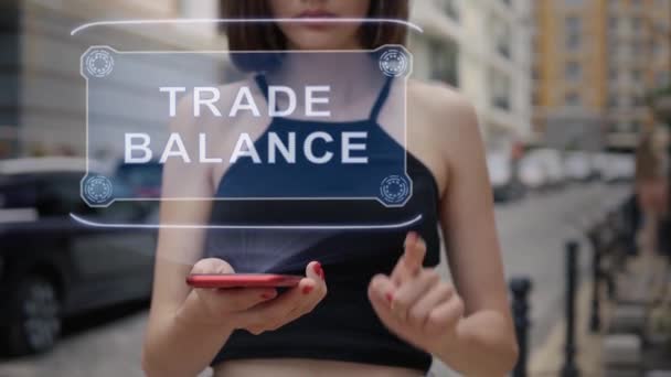 Young adult interacts hologram Trade Balance — Stock Video