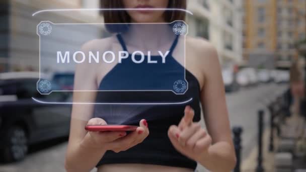 Young adult interacts hologram Monopoly — ストック動画