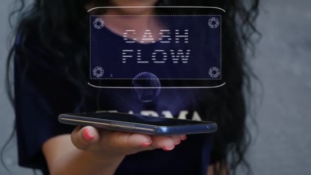 Женщина показывает голограмму HUD Cash Flow — стоковое видео