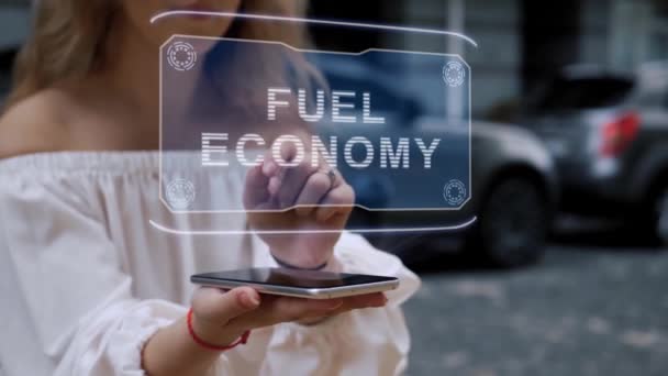 Blonde interacts HUD hologram Fuel Economy — Stock Video