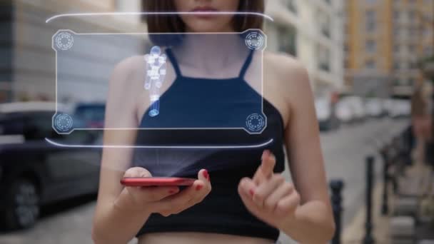 Young adult interacts hologram simple cyborg — Stock Video