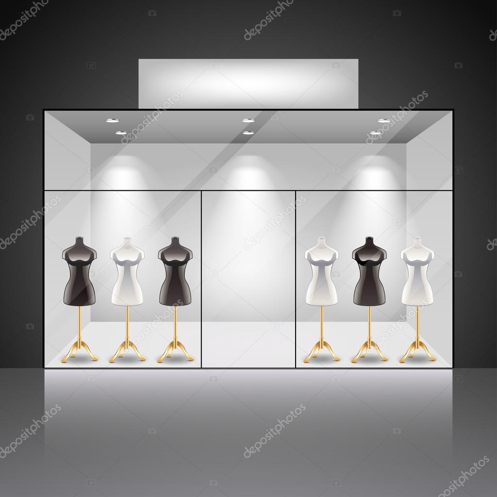 Illuminated shop showcase interior with mannequins