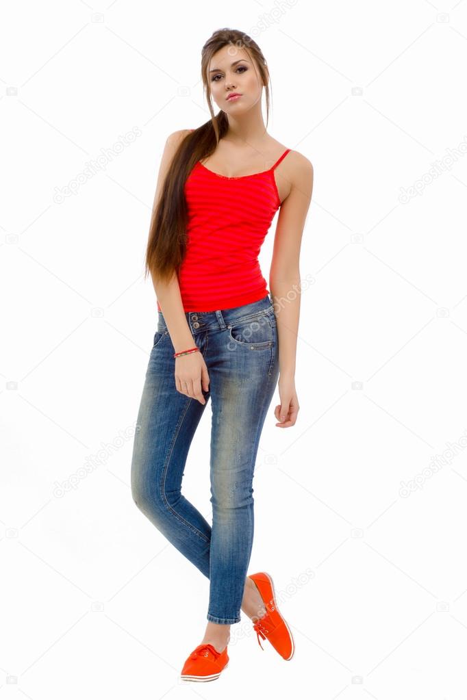 Young casual fashion beautiful girl standing in studio Stock Photo