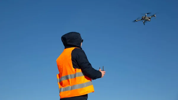 Drone flying in the blue sky. drone pilot, UAV , Multirotor, Photography, Helicopter , Drone, Unmanned copter flight, pilot flying dron