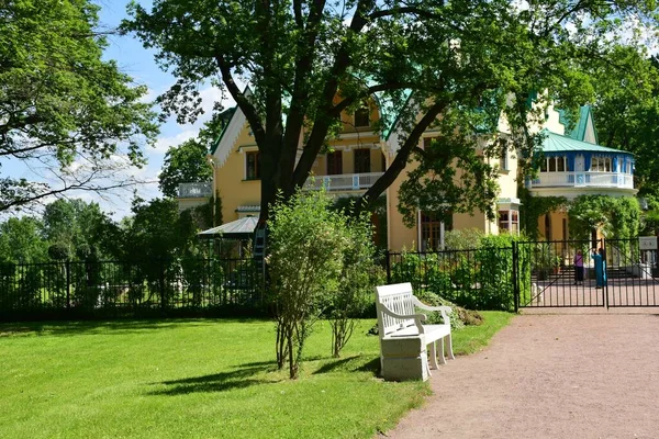 rich house in the garden, landscaping in the park, summer day