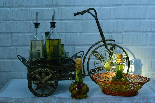 Still Life Cart Bottles Olive Oil Bouquet Flowers — 图库照片