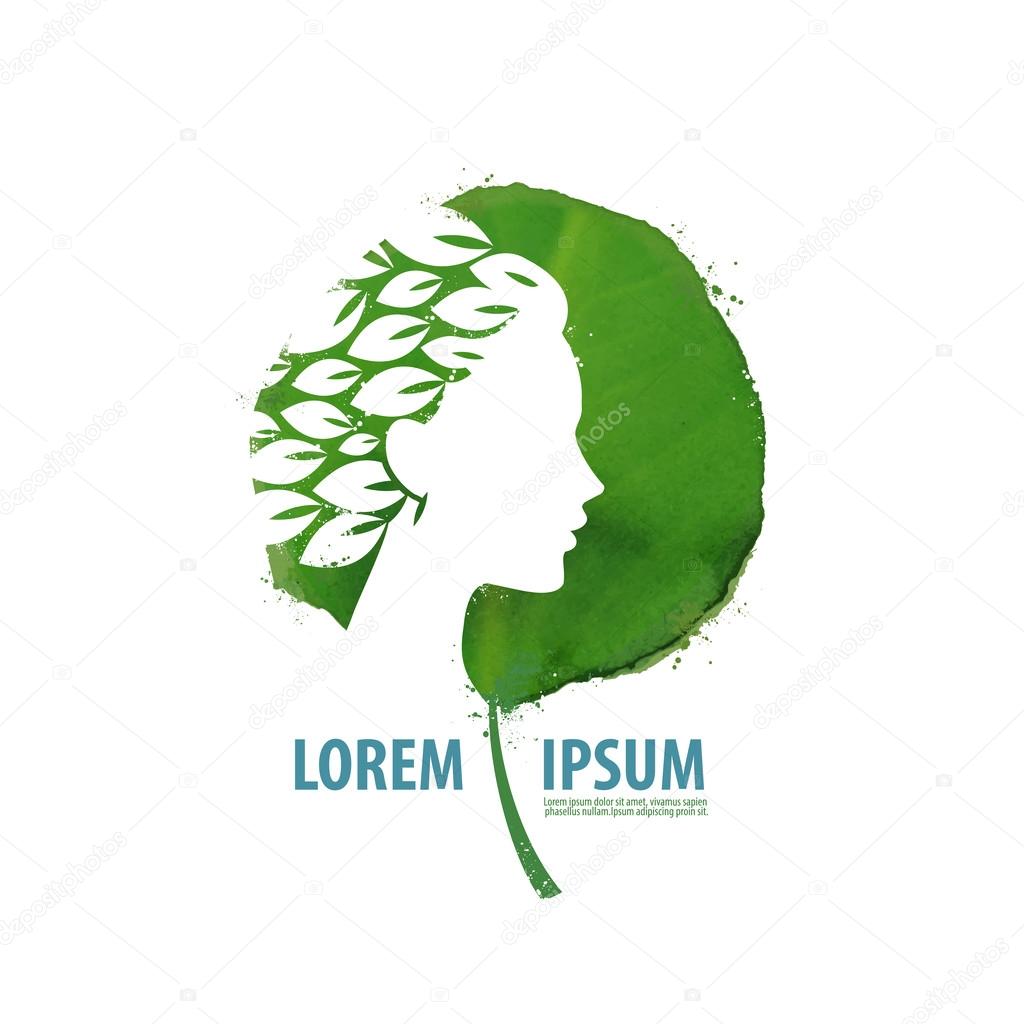 Beautiful face of a young girl on a background of green leaf