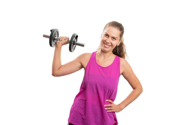 友善微笑的女人举重哑铃调理二头肌力量穿粉红运动服作为健身概念隔离在白色背景下 — 图库照片