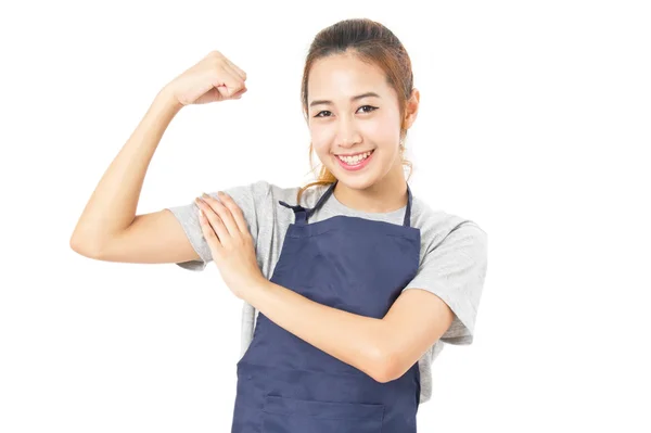 Asiática mujer usando delantal y flex su músculos aislado en blanco — Foto de Stock