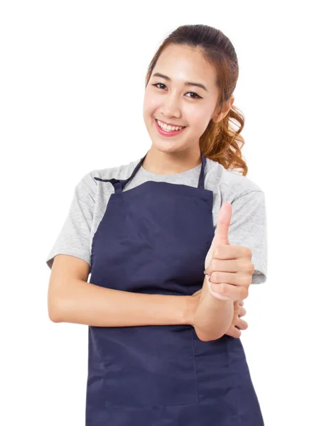 Ásia mulher vestindo avental mostrando polegares até com cópia espaço . — Fotografia de Stock