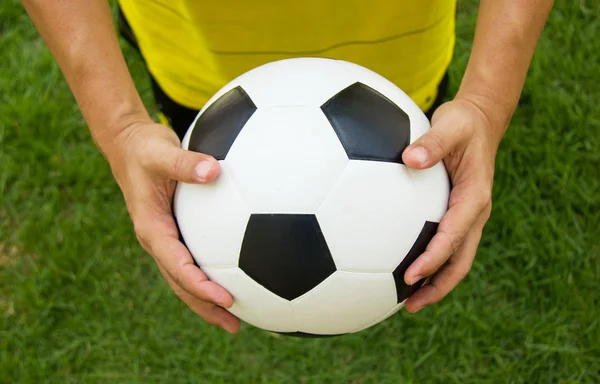 Soccer player holding a football. — Stock Photo, Image