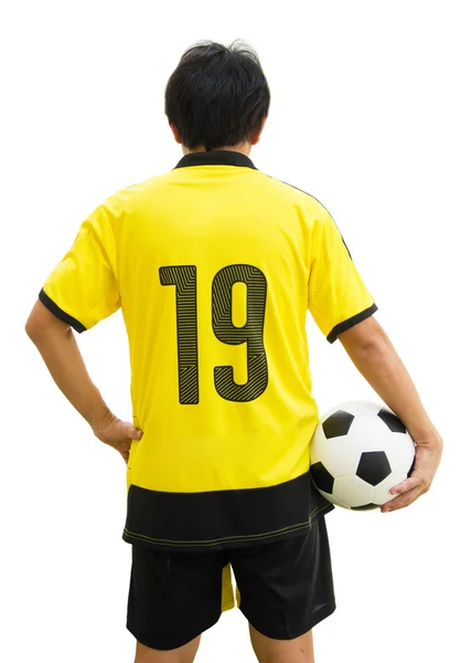 Widok z tyłu pionowe strzał azjatycki piłkarz posiadający piłkę na białym tle. — Zdjęcie stockowe