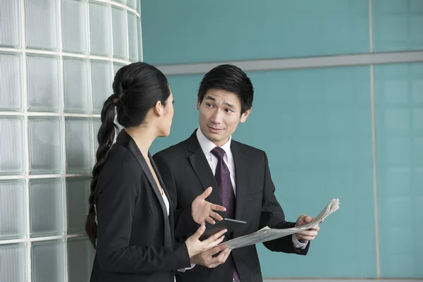 Asian Business man and woman discussing