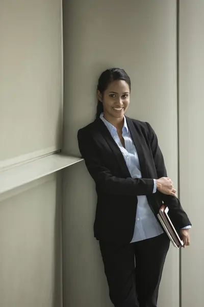 Indian businesswoman outside an office building