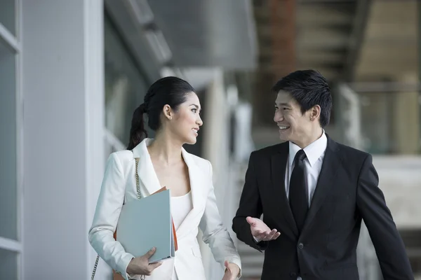 Chinese Business colleagues walking