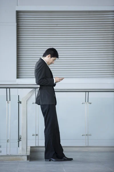 Chinese Businessman using a Phone