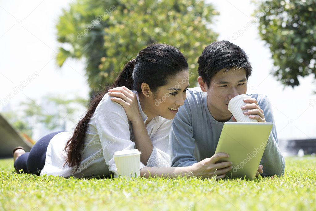 Outdoor watching asian couple