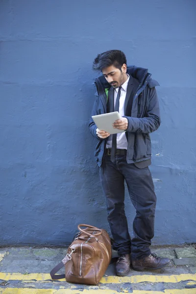 Indian businessman using tablet