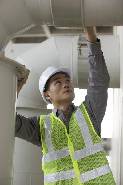 Chinese industrial engineer at work