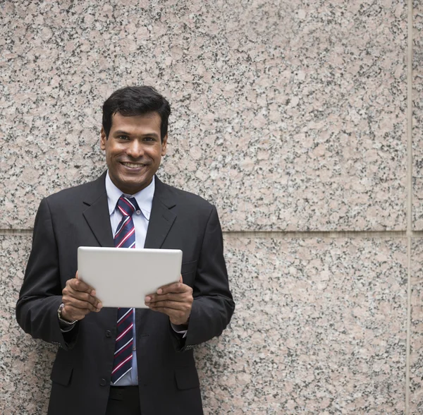 Indian businessman using tablet