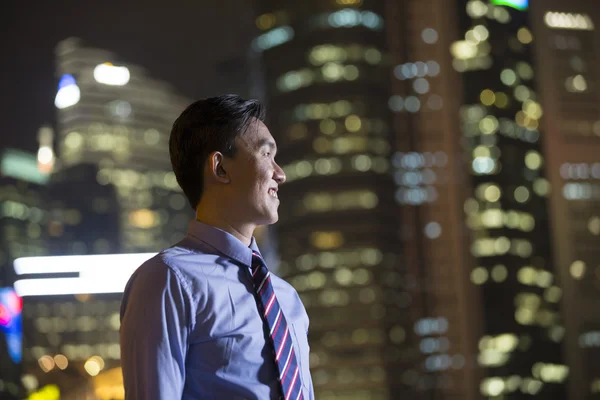 Chinese businessman outdoors at night