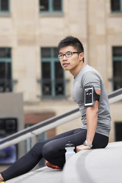 athletic Chinese man resting