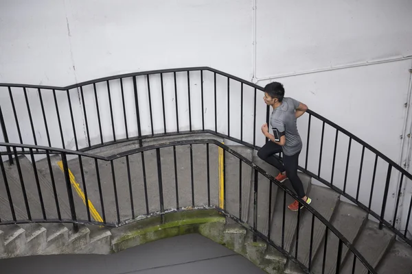 Chinese man running up stairs