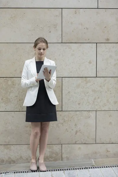 Caucasian Businesswoman using tablet