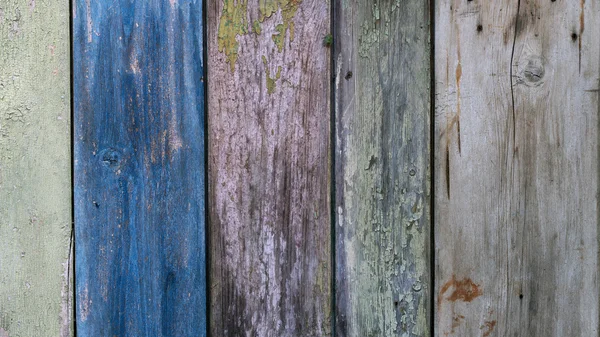 Boards farmhouse. Old boards, paint residues. Texture of wooden boards
