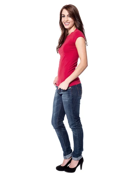 Woman posing with hands in pockets — Stock Photo, Image