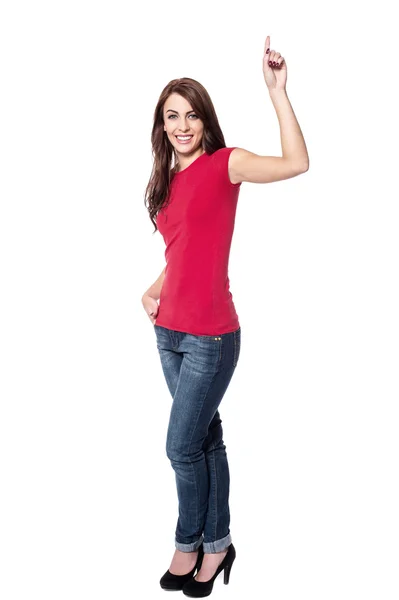 Pretty young woman pointing up — Stock Photo, Image