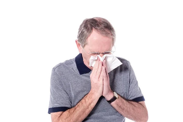 Senior man sneezing — Stock Photo, Image