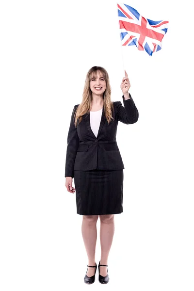 Businesswoman holding british flag — Stock Photo, Image