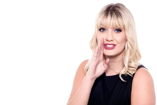 Beautiful woman whispering a secret — Stock Photo, Image