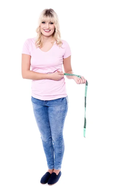 Pretty lady measuring her waist — Stock Photo, Image