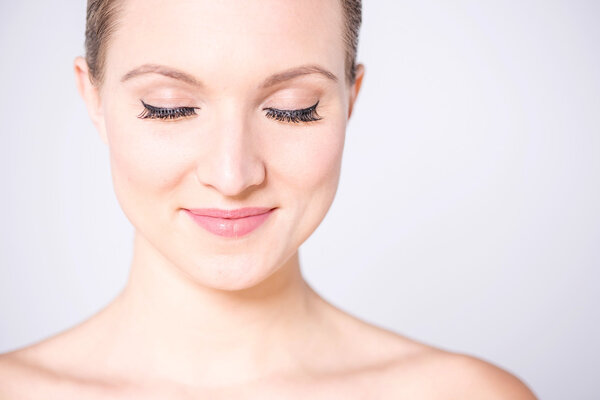 smiling woman with closed eyes