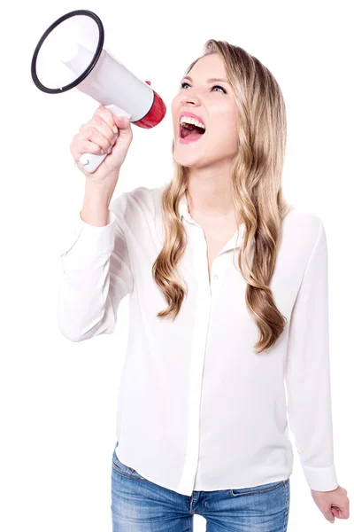 Woman making announcement in megaphone — Stock Photo, Image