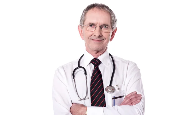 Elderly doctor with folded arms — Stock Photo, Image