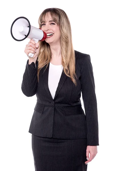 Attractive businesswoman with megaphone. Royalty Free Stock Images