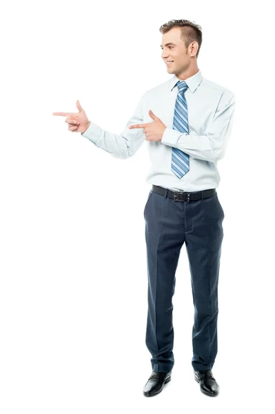 Young businessman pointing copyspace — Stock Photo, Image