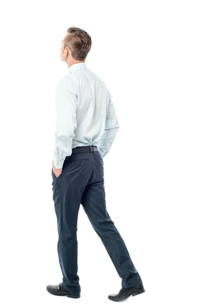 Businessman walking forward, hands in pocket — Stock Photo, Image