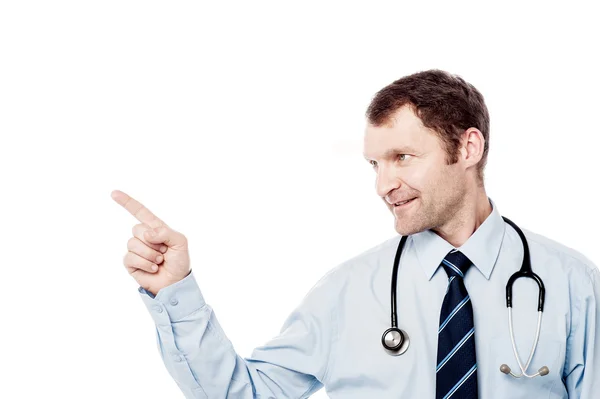 Male physician pointing his finger right — Stock Photo, Image