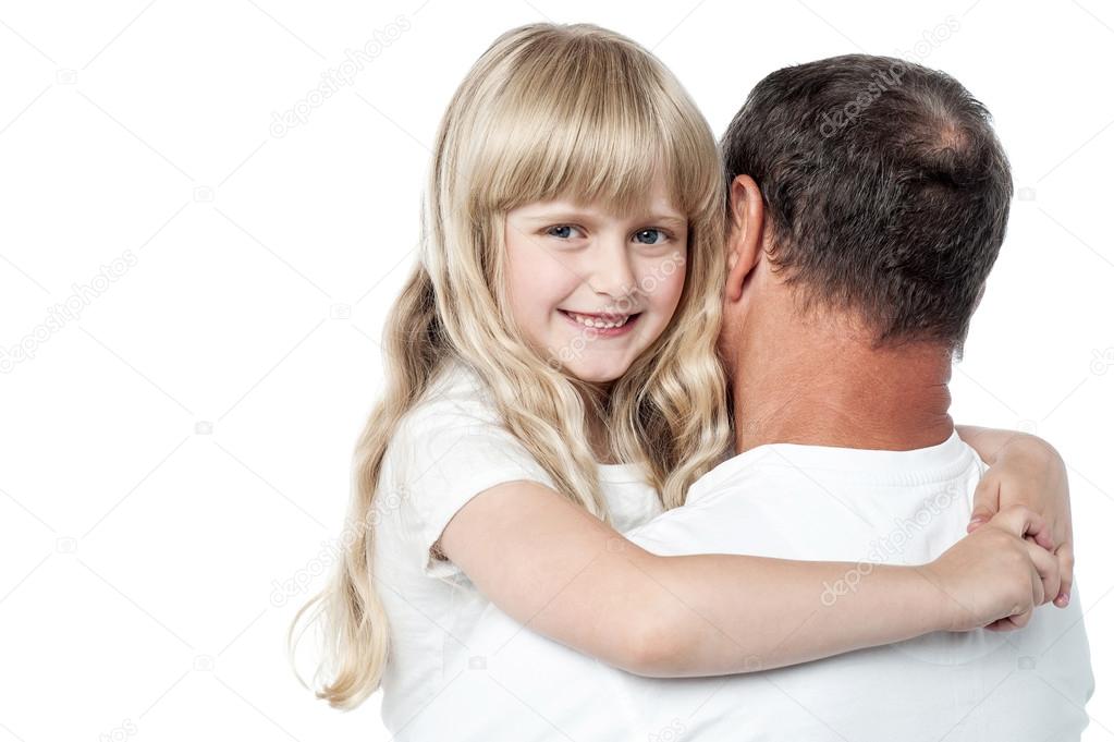 Father holding his daughter