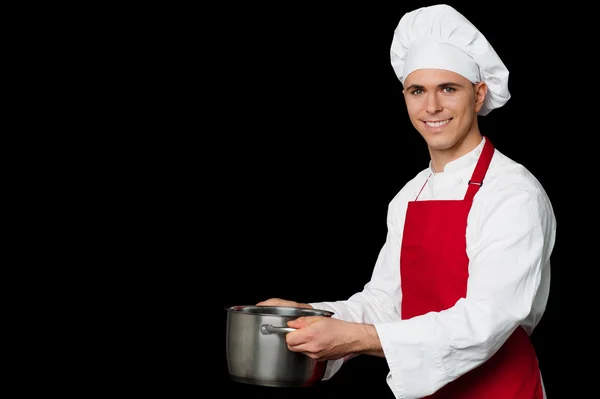 Male chef holding empty saucepan — Stock Photo, Image