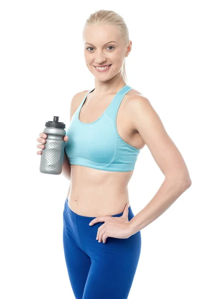 Fitness woman holding sipper bottle — Stock Photo, Image