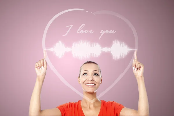 Woman with cardiograph and heart graphics — Stock Photo, Image