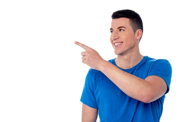 Smart guy looking and pointing away — Stock Photo, Image