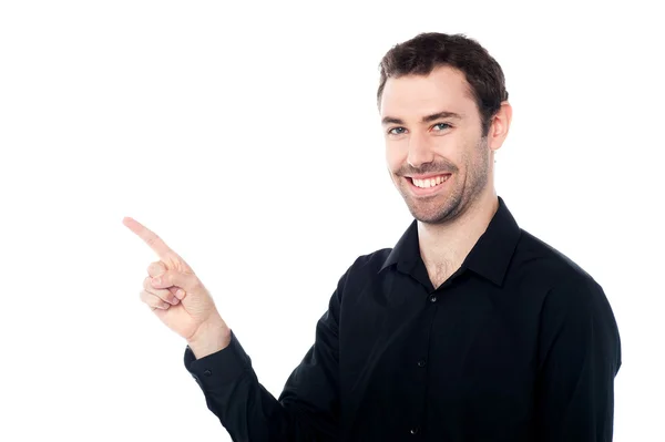 Man pointing towards copy space area — Stock Photo, Image