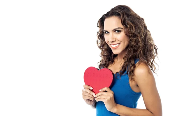 Young woman holding a red paper heart — Stock Photo, Image